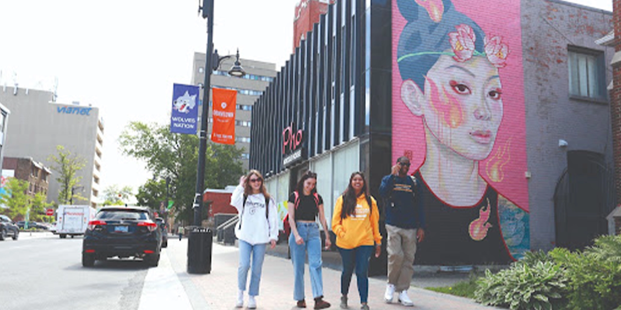 Group of friends walking in downtown Sudbury